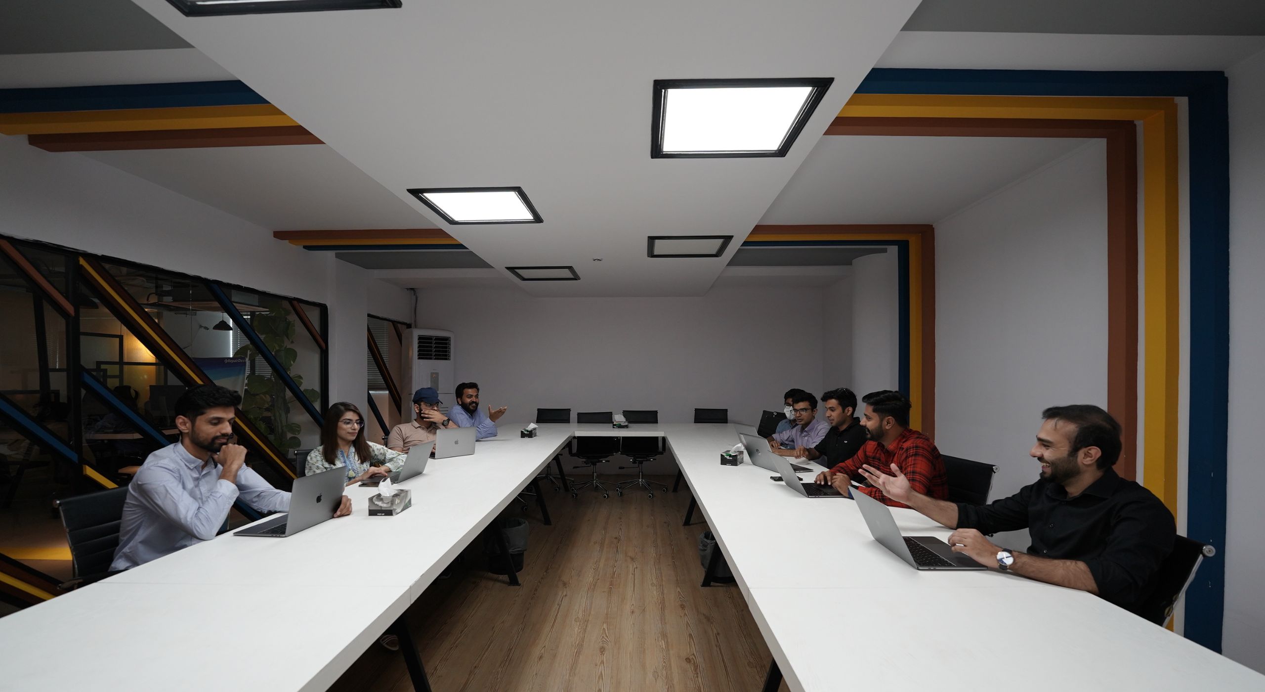 Presenter speaking beside a monitor