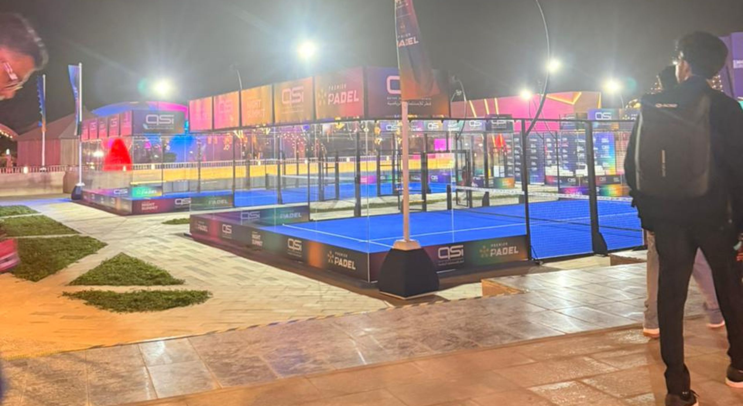 Three teammates talking in an office